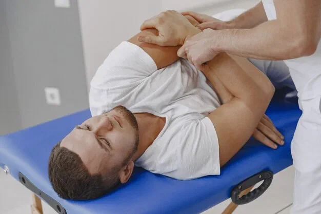 Physical therapist performing hands-on manual therapy on a patient at Root Therapy and Wellness in Bozeman, Montana