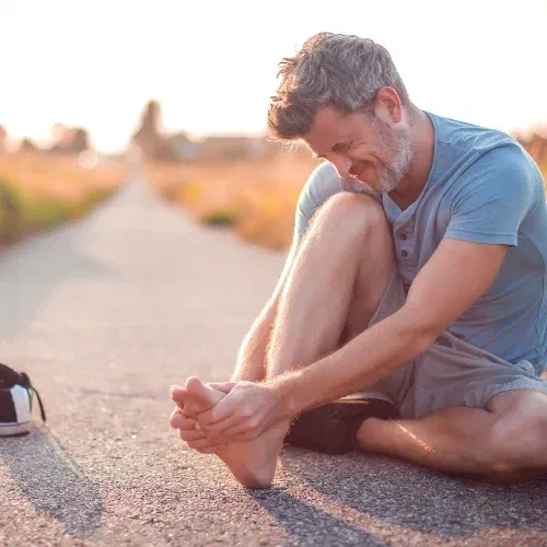 Physical therapist guiding single-leg balance retraining for an ankle sprain at Root Therapy and Wellness in Bozeman, Montana