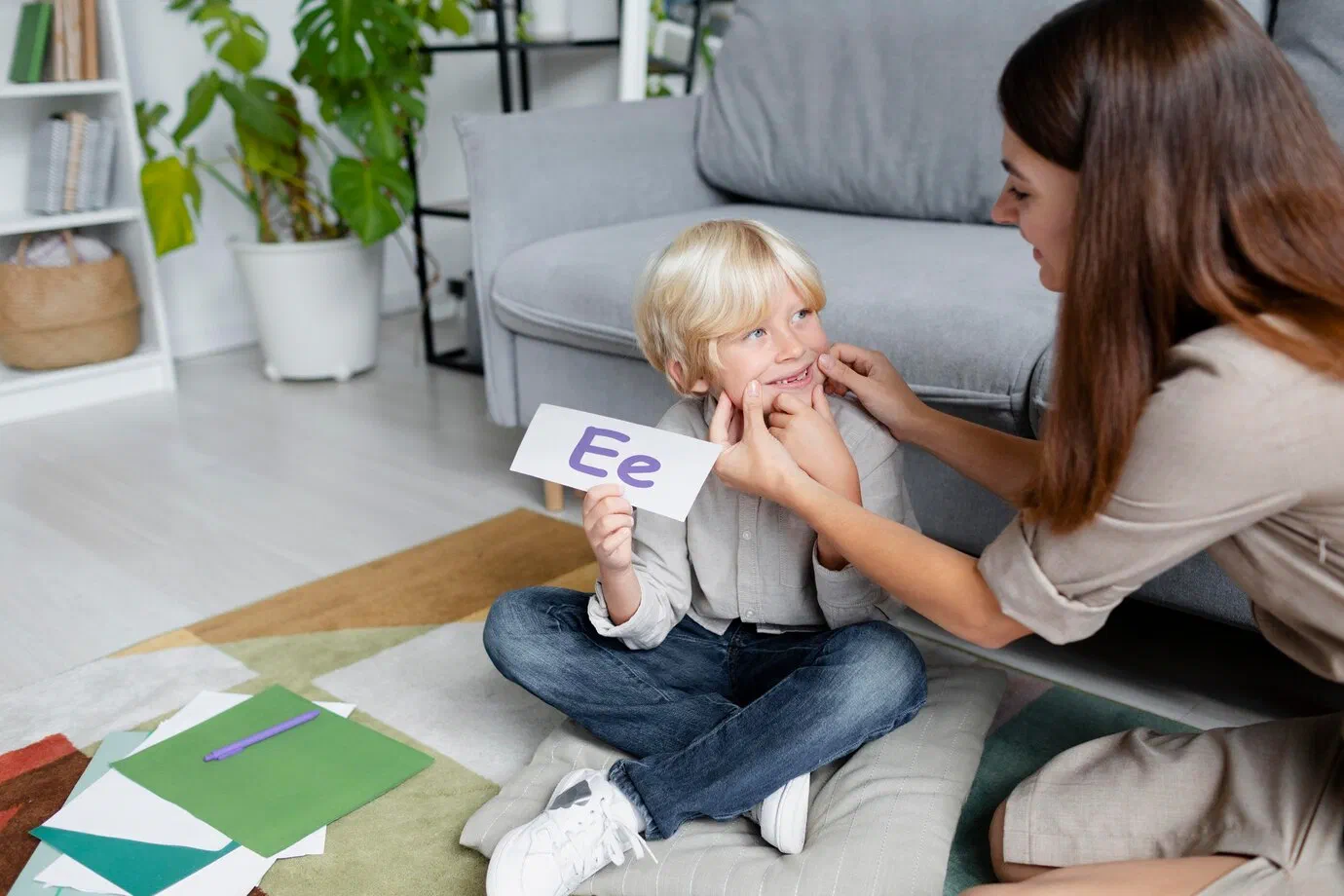 Pediatric speech-language pathologist working with a young child during play-based therapy at Root Pediatrics in Bozeman, Montana