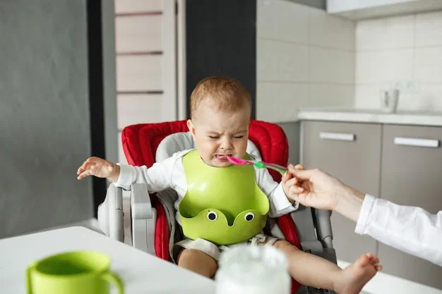 Occupational therapist guiding pressure-free food exploration with a young child at Root Pediatrics in Bozeman, Montana