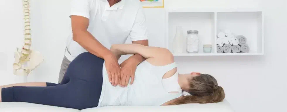 Physical therapist performing gentle nerve mobilization for sciatica at Root Therapy and Wellness in Bozeman, Montana