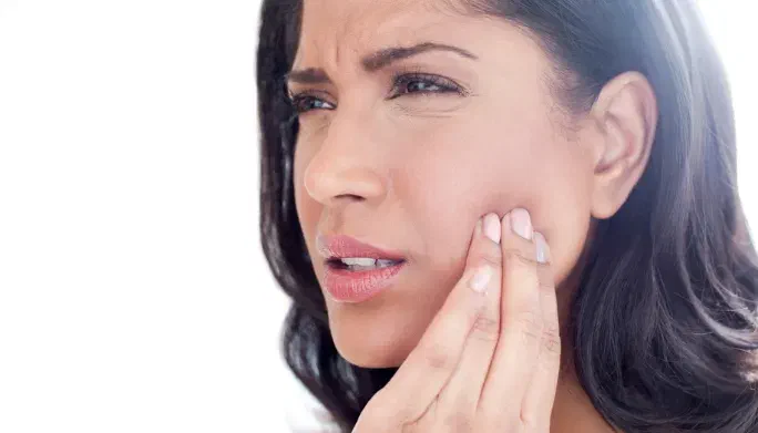 Physical therapist providing gentle jaw and neck treatment for TMJ pain at Root Therapy and Wellness in Bozeman, Montana